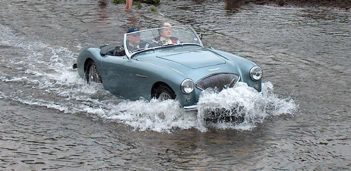  A fine bow wave as Eric Perry tackles the large ford at Tissington.