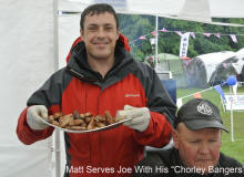 Matt serves Joe with his "Chorley" Bangers