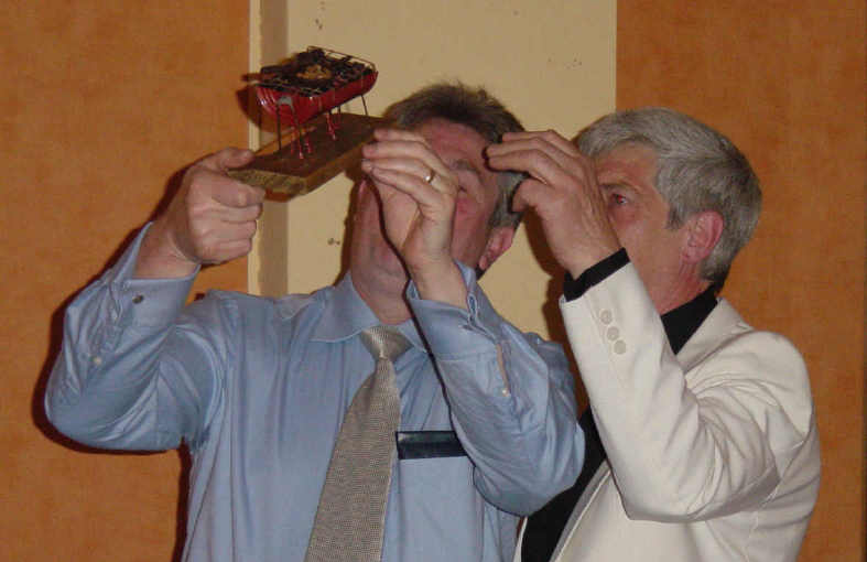 Ken Broster receiving his barbecue trophy from Dave Haslam