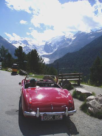 Ivor and Pam's Healey overlooking the Monteratsch Glacier.